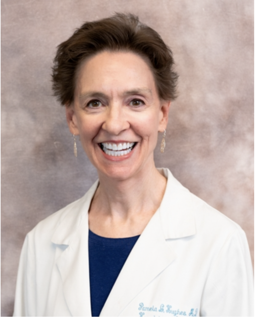 Headshot of a doctor wearing a white lab coat and stethoscope, smiling.